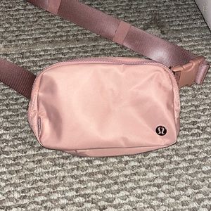 NWOT lulu everywhere belt bag. never worn in perfect condition. Pink Pastel
